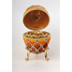 Orange Faberge Egg with Gold Clock Inside by Keren Kopal