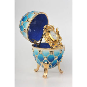 Light Blue Faberge Egg with Gold Clock Inside by Keren Kopal