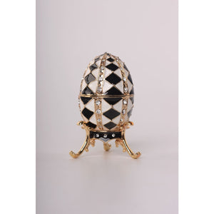 Black and White Faberge Egg with Gold Necklace Inside by Keren Kopal